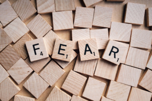 Canva – Word Fear Written on Wooden Scrabble Letters